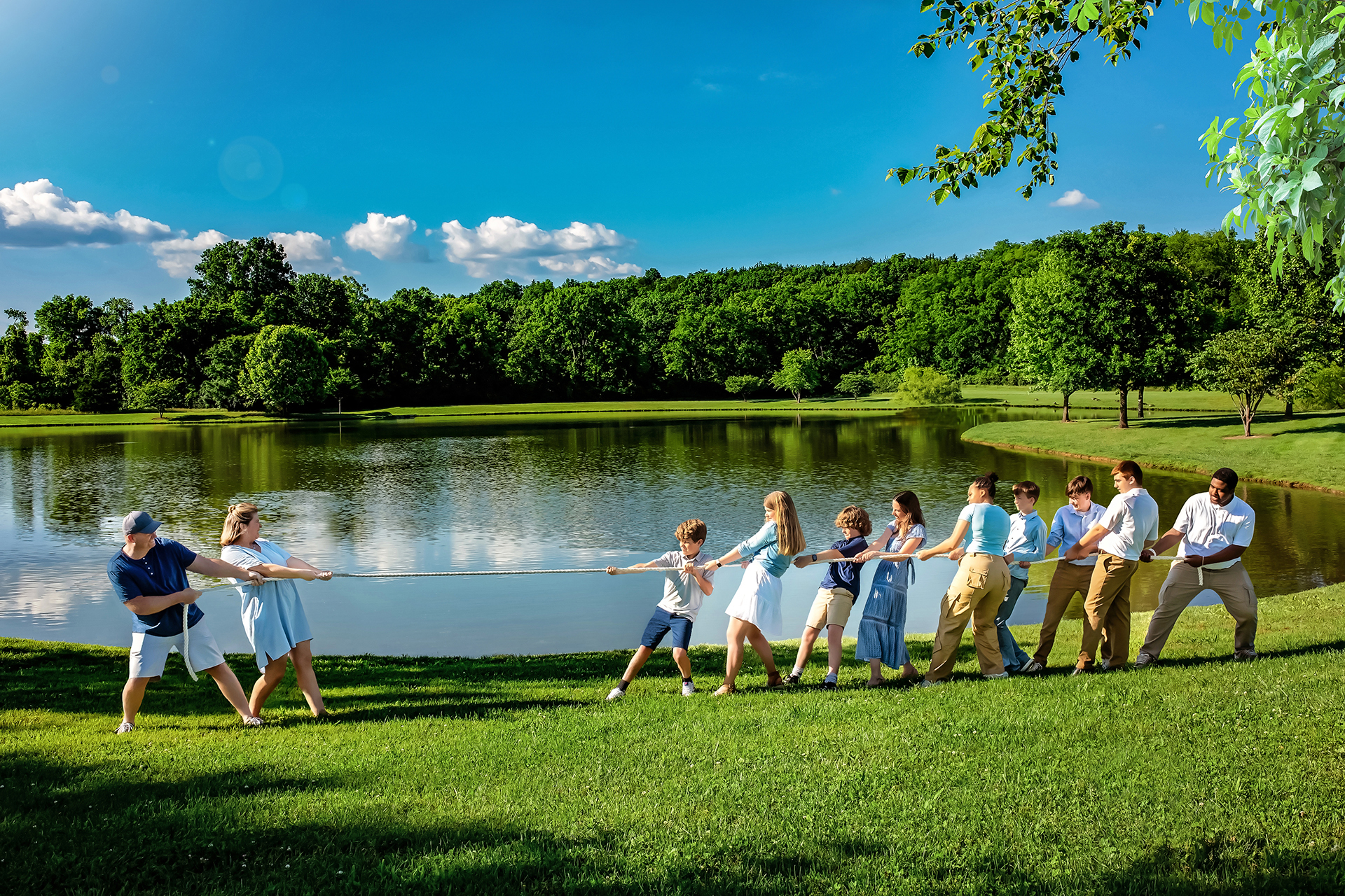 Brothers laughing during playful tug of war family portrait session Franklin TN”, “Sibling bond captured in outdoor family photography Franklin